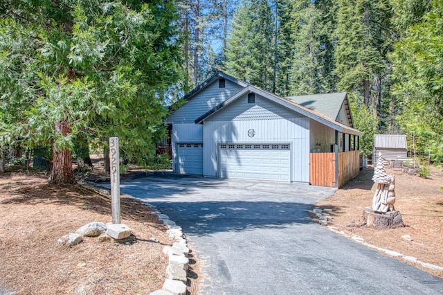 exterior space with an attached garage and aphalt driveway