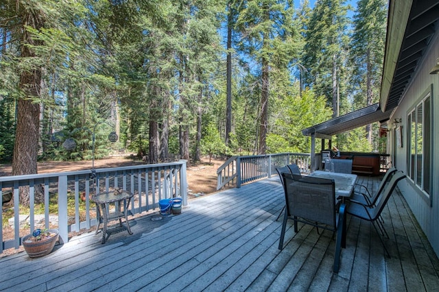 wooden deck featuring outdoor dining space