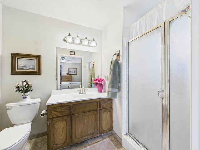 full bathroom featuring vanity, connected bathroom, a stall shower, and toilet
