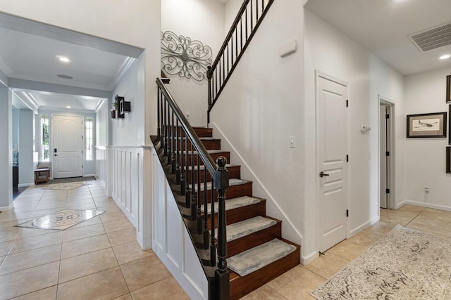 1389 Vineyard Pl, Hanford, CA 93230 - staircase with crown molding, baseboards, tile patterned flooring, and visible vents