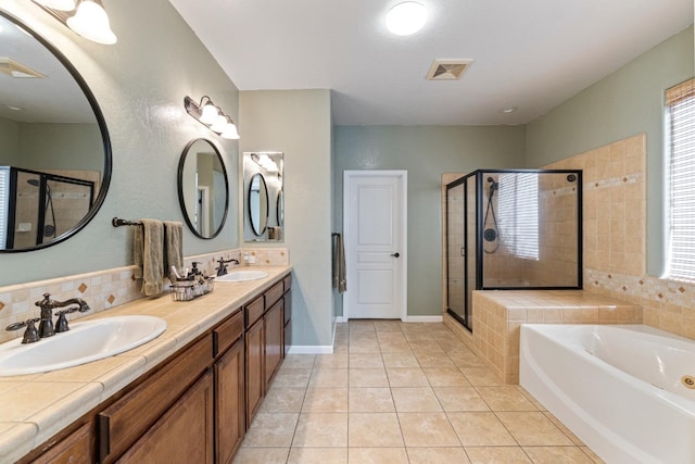 1389 Vineyard Pl, Hanford, CA 93230 - full bath with a sink, tile patterned flooring, a shower stall, visible vents, and a bath