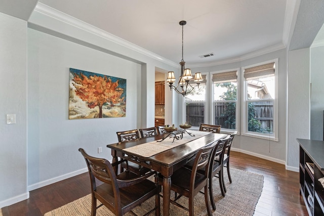 1389 Vineyard Pl, Hanford, CA 93230 - dining space with visible vents, ornamental molding, an inviting chandelier, and dark wood-type flooring