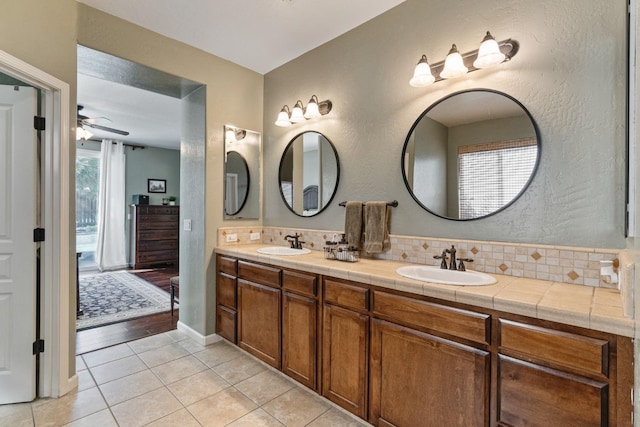 1389 Vineyard Pl, Hanford, CA 93230 - full bathroom featuring double vanity, a sink, a ceiling fan, and tile patterned floors