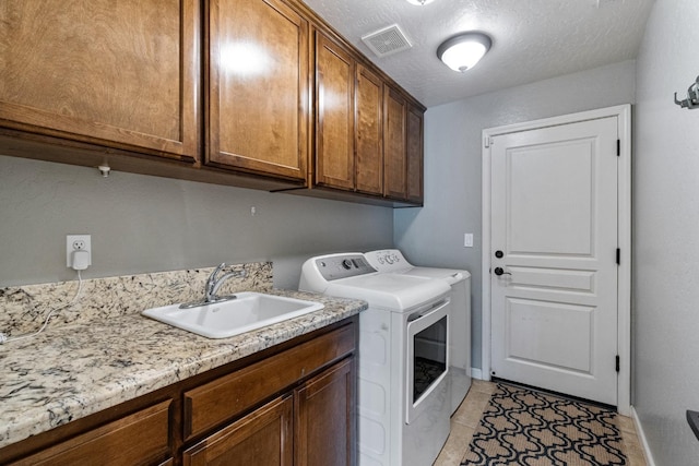 1389 Vineyard Pl, Hanford, CA 93230 - clothes washing area with visible vents, cabinet space, a sink, separate washer and dryer, and light tile patterned flooring