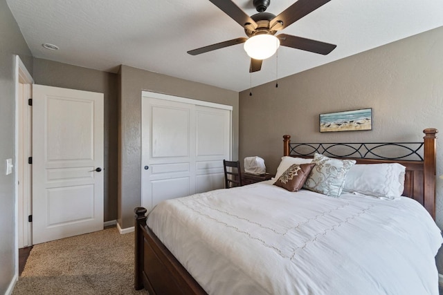 1389 Vineyard Pl, Hanford, CA 93230 - carpeted bedroom with baseboards, a textured wall, a ceiling fan, and a closet