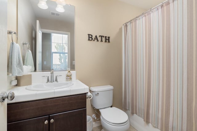 full bathroom with vanity, toilet, and visible vents