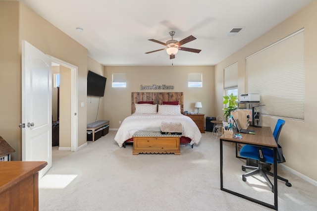 bedroom with a ceiling fan, baseboards, visible vents, and carpet