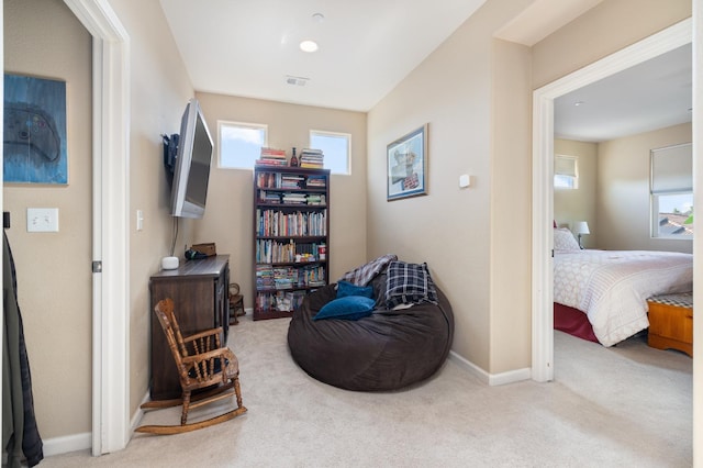 sitting room featuring baseboards, carpet, and visible vents