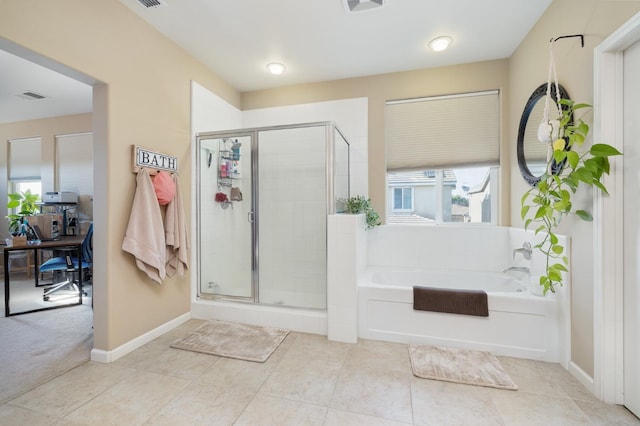 bathroom featuring tile patterned floors, visible vents, a garden tub, and a stall shower