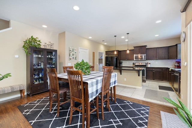 dining room featuring recessed lighting and light wood-type flooring