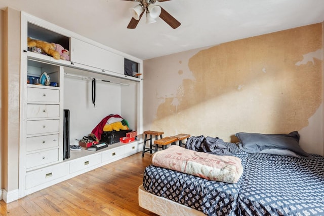 bedroom featuring ceiling fan and wood finished floors