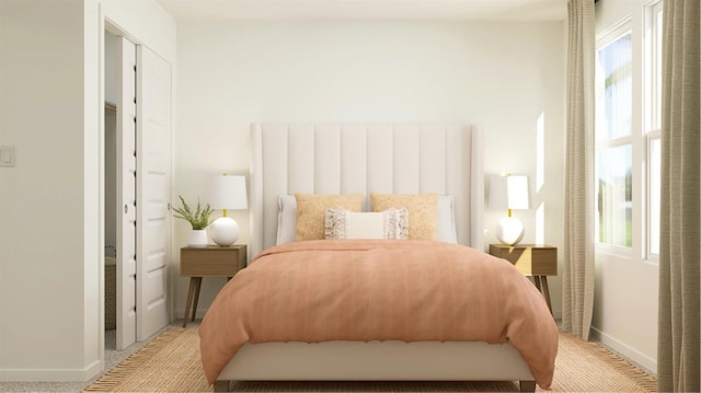 bedroom with baseboards, multiple windows, and light colored carpet
