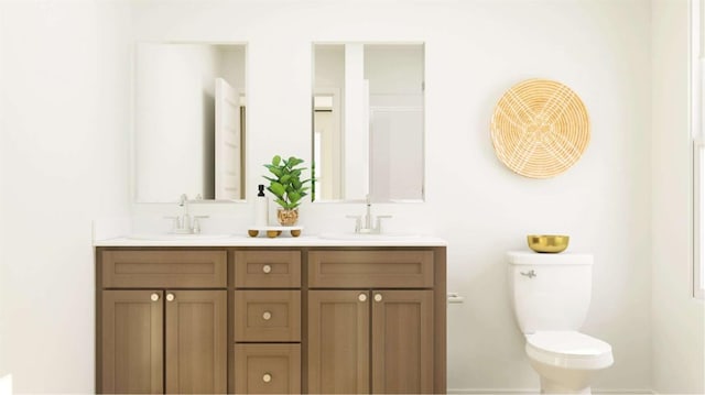 bathroom with double vanity, a sink, baseboards, and toilet