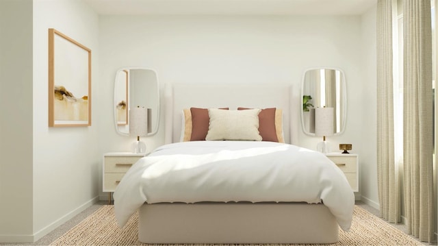 bedroom with baseboards and light carpet