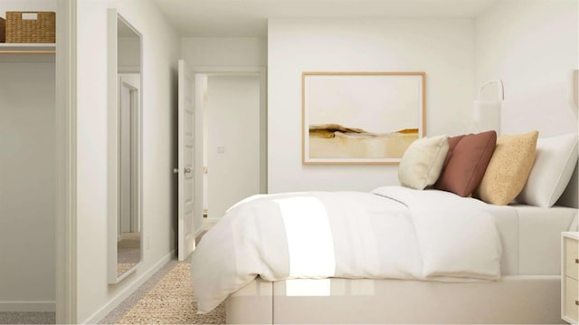 bedroom with baseboards and speckled floor