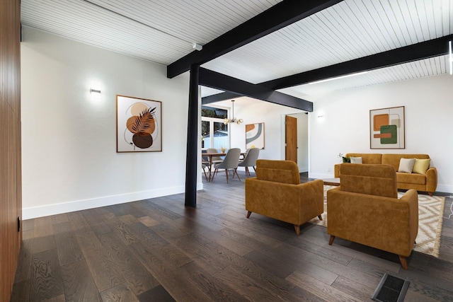 living room with visible vents, beam ceiling, baseboards, dark wood-style floors, and an inviting chandelier