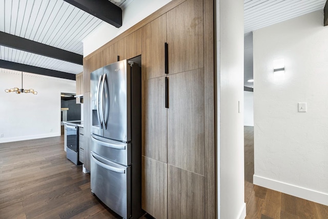 kitchen with dark wood-style flooring, beamed ceiling, range with electric stovetop, baseboards, and stainless steel fridge with ice dispenser
