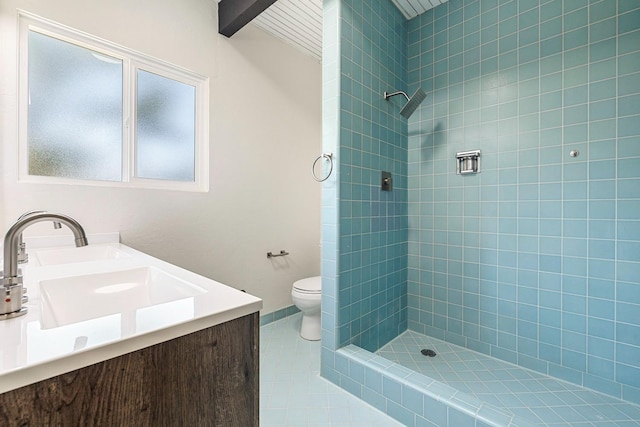 full bath featuring tile patterned floors, beam ceiling, toilet, and tiled shower