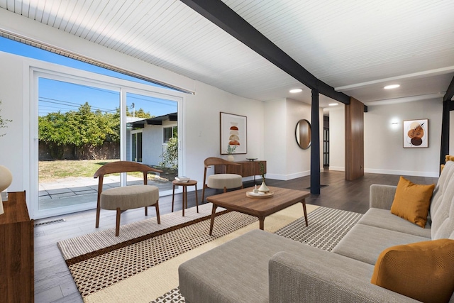 living area featuring visible vents, wood finished floors, beamed ceiling, baseboards, and recessed lighting