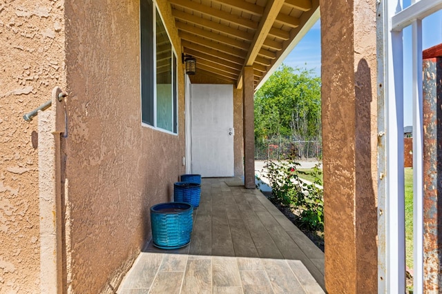 view of side of home featuring stucco siding