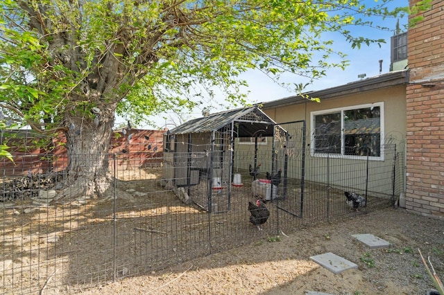 view of yard with exterior structure and an outbuilding