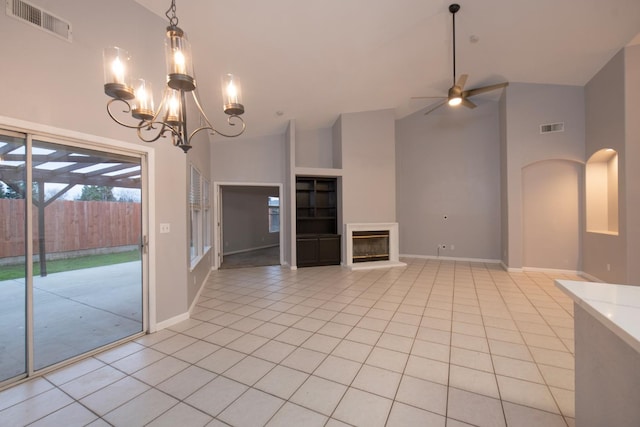 7224 N Bonadelle Ave, Fresno, CA 93720 - unfurnished living room featuring visible vents, light tile patterned floors, and high vaulted ceiling