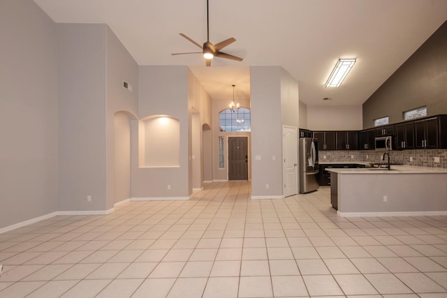 7224 N Bonadelle Ave, Fresno, CA 93720 - kitchen with high vaulted ceiling, appliances with stainless steel finishes, and open floor plan