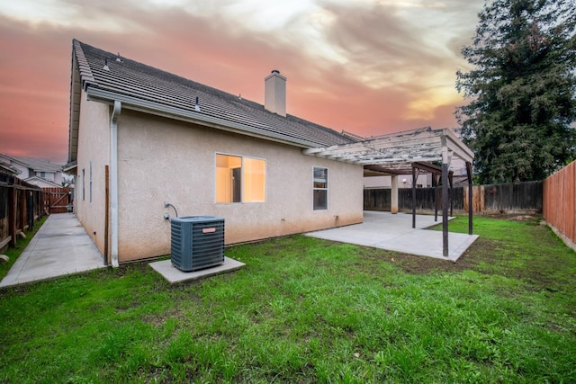 7224 N Bonadelle Ave, Fresno, CA 93720 - back of house with central air condition unit, a patio, stucco siding, and a fenced backyard