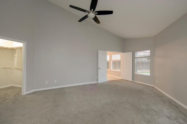 7224 N Bonadelle Ave, Fresno, CA 93720 - unfurnished bedroom with high vaulted ceiling, baseboards, carpet floors, and a spacious closet