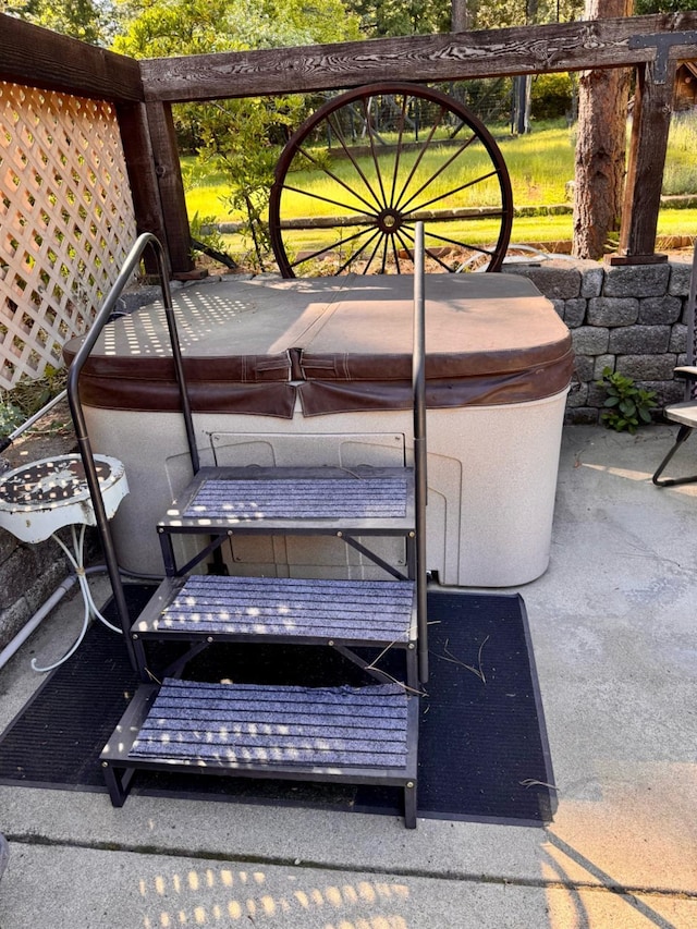 exterior details featuring a jacuzzi