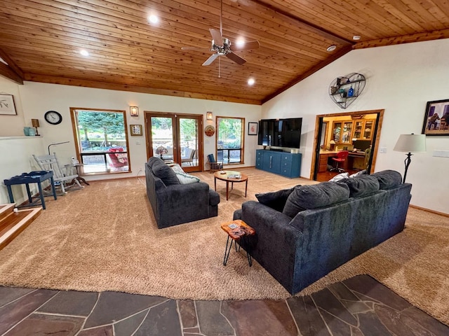 carpeted living area with a wealth of natural light, ceiling fan, vaulted ceiling, and wooden ceiling