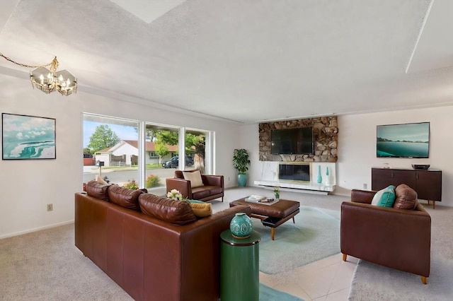 living room with an inviting chandelier, carpet flooring, baseboards, and a stone fireplace