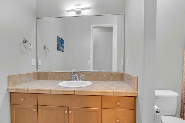 half bath with vanity and toilet