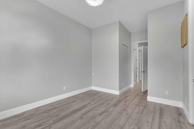 2845 E Goshen Ave, Fresno, CA 93720 - unfurnished room featuring light wood-style floors and baseboards