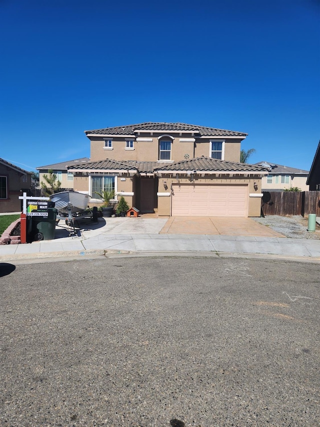 1439 De Ann Cv, Madera, CA 93637 - traditional-style house featuring a tiled roof, stucco siding, fence, and concrete driveway