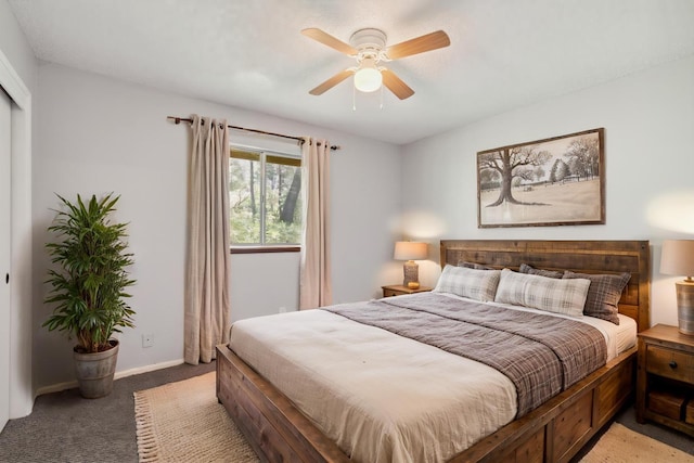 bedroom with baseboards, ceiling fan, and light colored carpet
