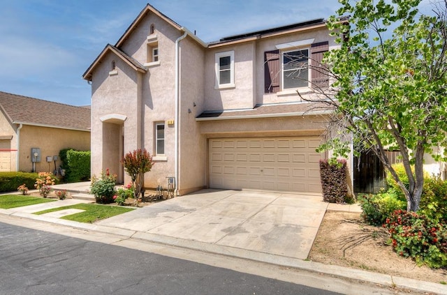 619 W Casanova Ln, Clovis, CA 93619 - view of front of house with stucco siding, an attached garage, concrete driveway, and fence