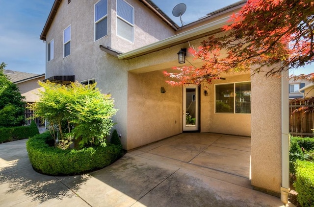 619 W Casanova Ln, Clovis, CA 93619 - view of exterior entry featuring stucco siding and a patio