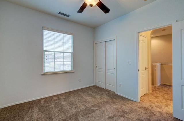 619 W Casanova Ln, Clovis, CA 93619 - unfurnished bedroom with carpet floors, a closet, arched walkways, and baseboards