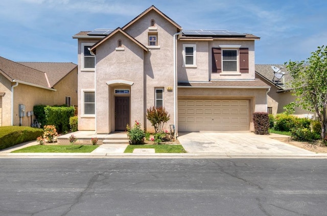619 W Casanova Ln, Clovis, CA 93619 - view of front of home featuring stucco siding, solar panels, driveway, and an attached garage