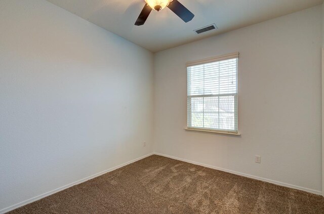 619 W Casanova Ln, Clovis, CA 93619 - empty room with dark carpet, a ceiling fan, and baseboards