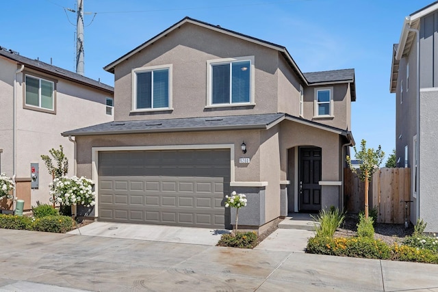 6260 E Malbec Dr, Fresno, CA 93727 - traditional-style house featuring a garage, fence, driveway, and stucco siding