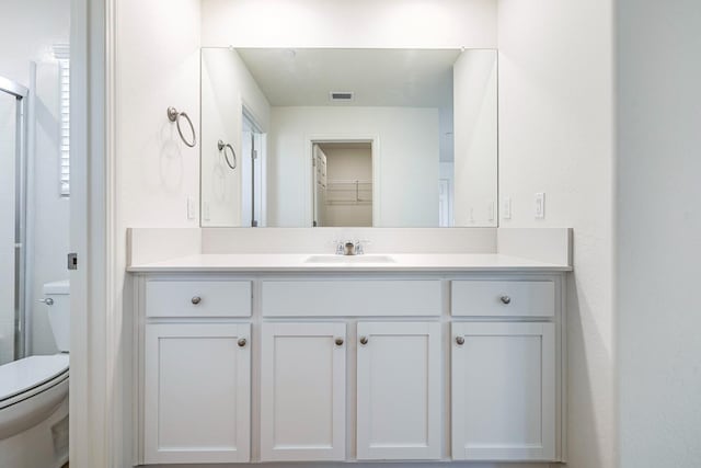 6260 E Malbec Dr, Fresno, CA 93727 - bathroom with an enclosed shower, toilet, visible vents, and vanity
