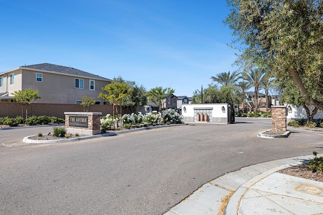 6260 E Malbec Dr, Fresno, CA 93727 - view of street featuring curbs, a gated entry, and a residential view