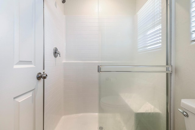 6260 E Malbec Dr, Fresno, CA 93727 - full bathroom with a stall shower and toilet
