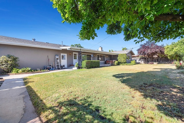 6154 E Alta Ave, Fresno, CA 93727 - exterior space featuring fence, stucco siding, and a front lawn