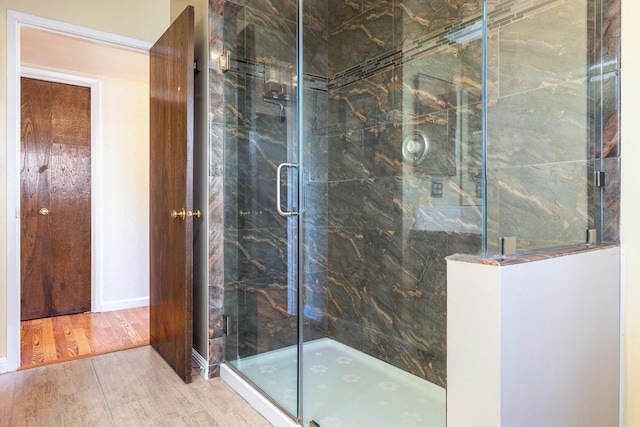 6154 E Alta Ave, Fresno, CA 93727 - full bathroom with a marble finish shower and wood finished floors
