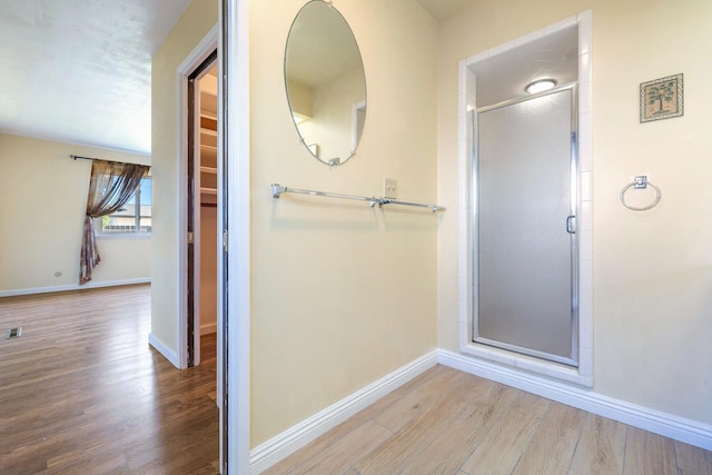 6154 E Alta Ave, Fresno, CA 93727 - full bath featuring baseboards, a stall shower, wood finished floors, and visible vents