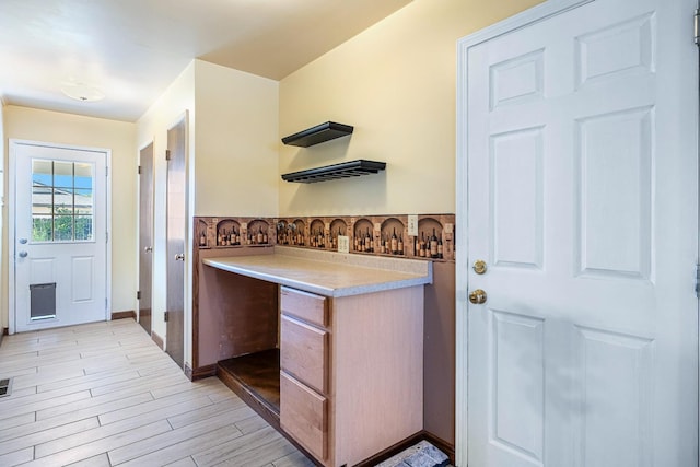 6154 E Alta Ave, Fresno, CA 93727 - kitchen featuring light countertops, tasteful backsplash, and light wood-style floors