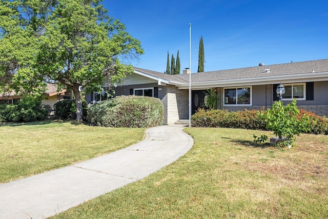 6154 E Alta Ave, Fresno, CA 93727 - ranch-style house with brick siding, a chimney, and a front yard